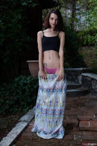 Adorable Brunette Removes Her Dress And Uncovers Peachy Ass Accentuated With Sexy Pink Undies