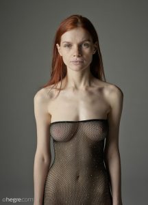 Seductress Vi Pulls Up And Down Her Fishnet Outfit As She Displays Assets Of Her Skinny Body In A Passionate Manner